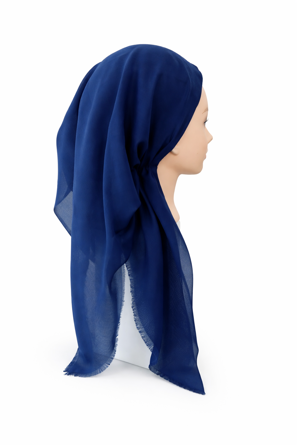 Navy blue tichel on a mannequin head against a white background