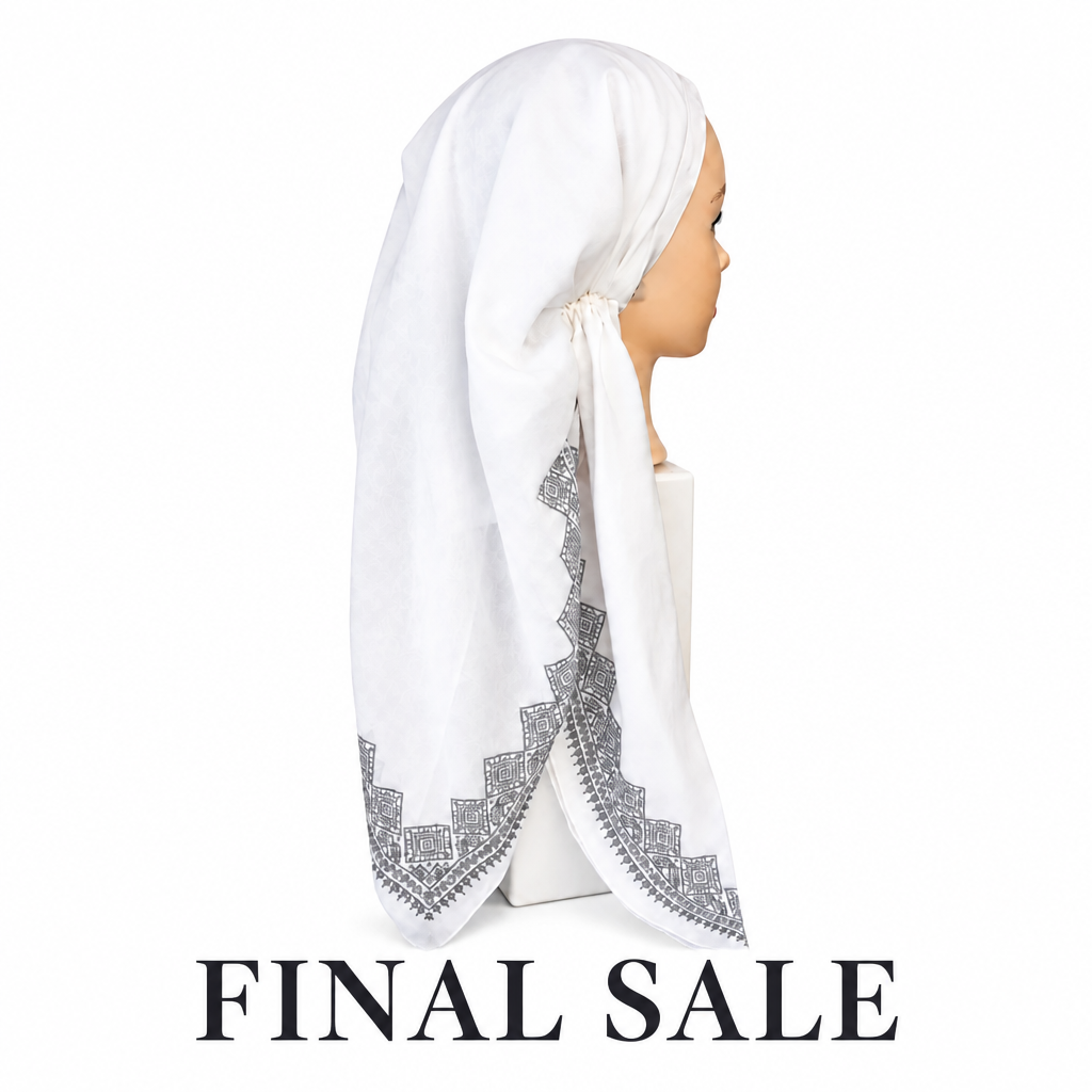 A white headscarf with a gray geometric embroidered border, displayed on a mannequin head in profile against a white background.