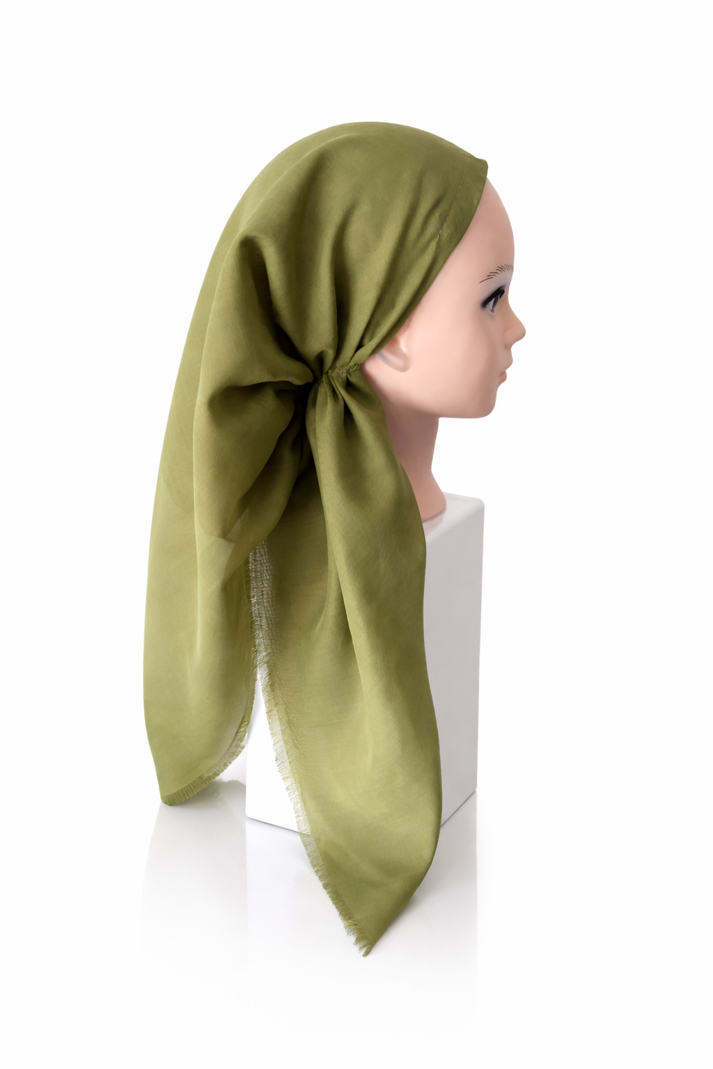 Mannequin head wearing a green pretied tichel with a white background