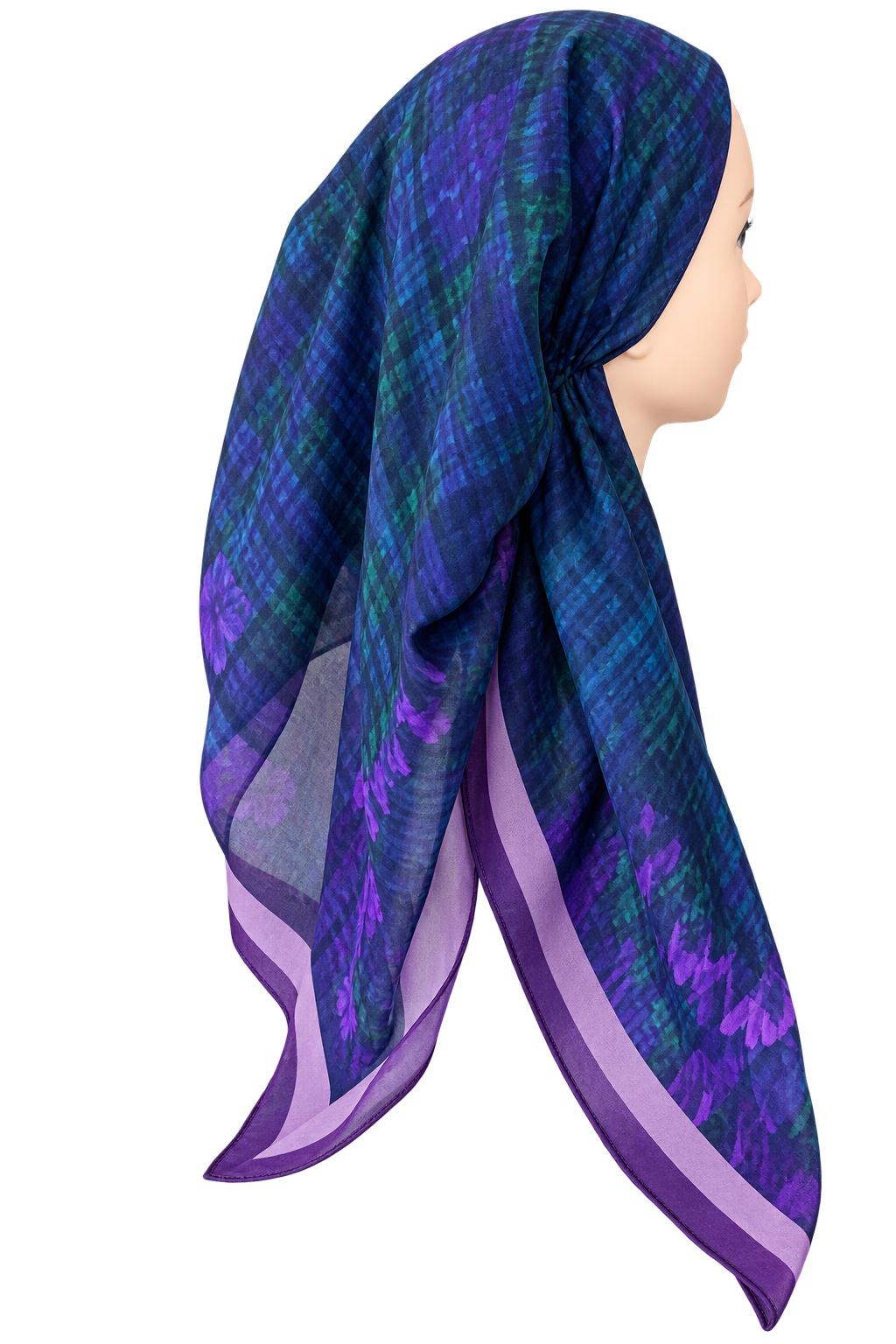 A purple and blue patterned headscarf wrapped on a mannequin head, shown in profile against a plain white background.