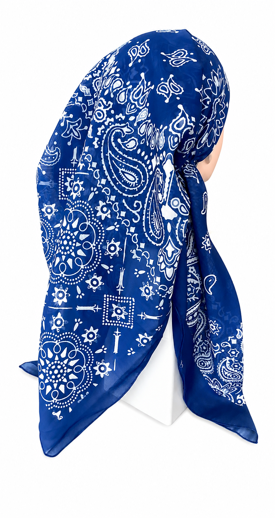 A blue and white paisley bandana headscarf styled on a mannequin head against a plain white background.