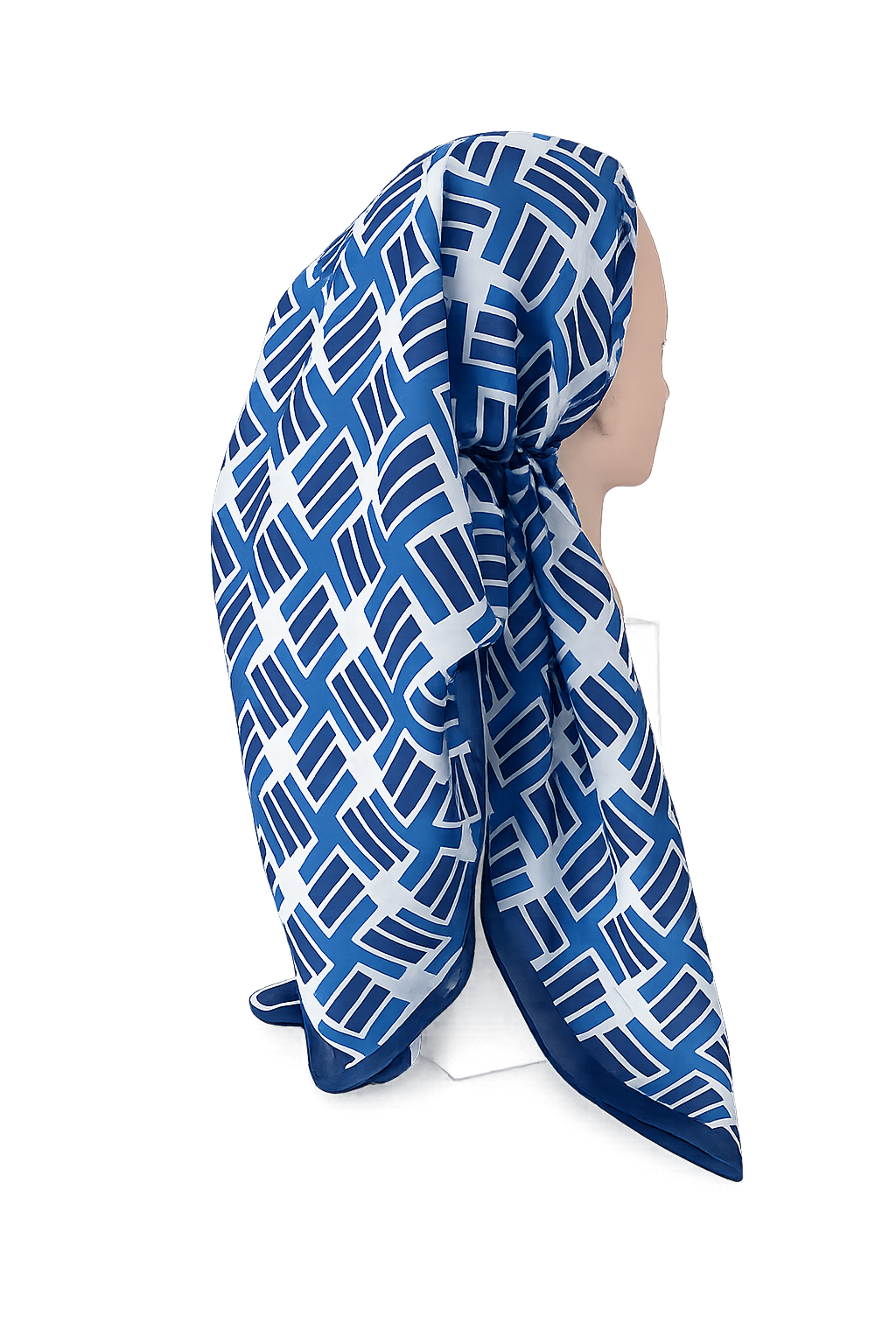 Blue and white patterned headscarf on a mannequin against a white background