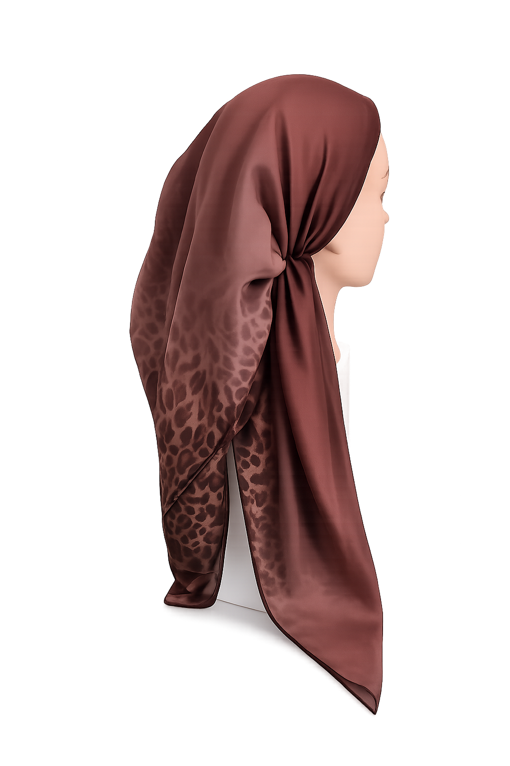 A red tichel with a leopard print pattern, styled on a mannequin head against a white background.