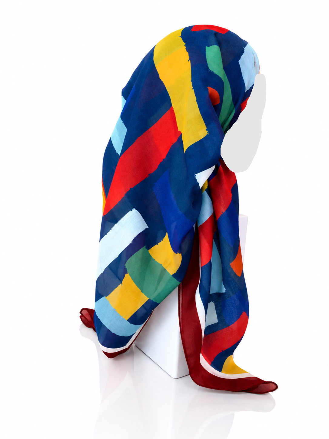 Colorful striped scarf on a mannequin head against a white background