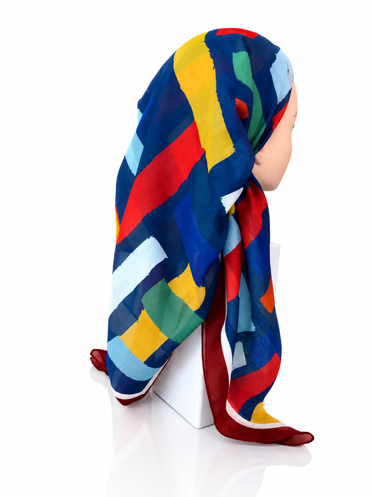 Colorful striped headscarf on a mannequin against a white background