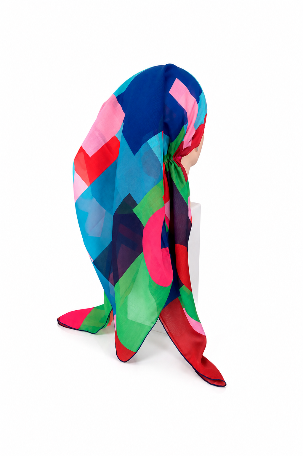 Colorful geometric patterned scarf on a white background