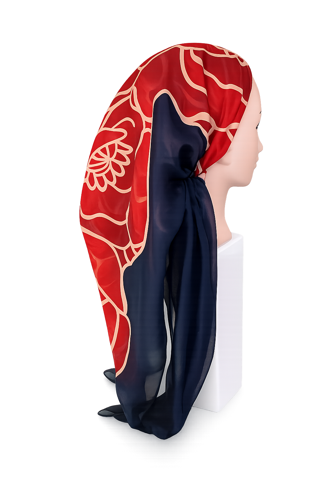 Red and navy tichel with floral patterns on a mannequin head against a white background
