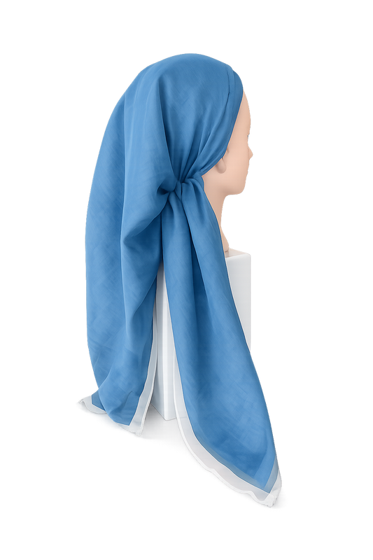 Blue Tichel on a mannequin head against a white background