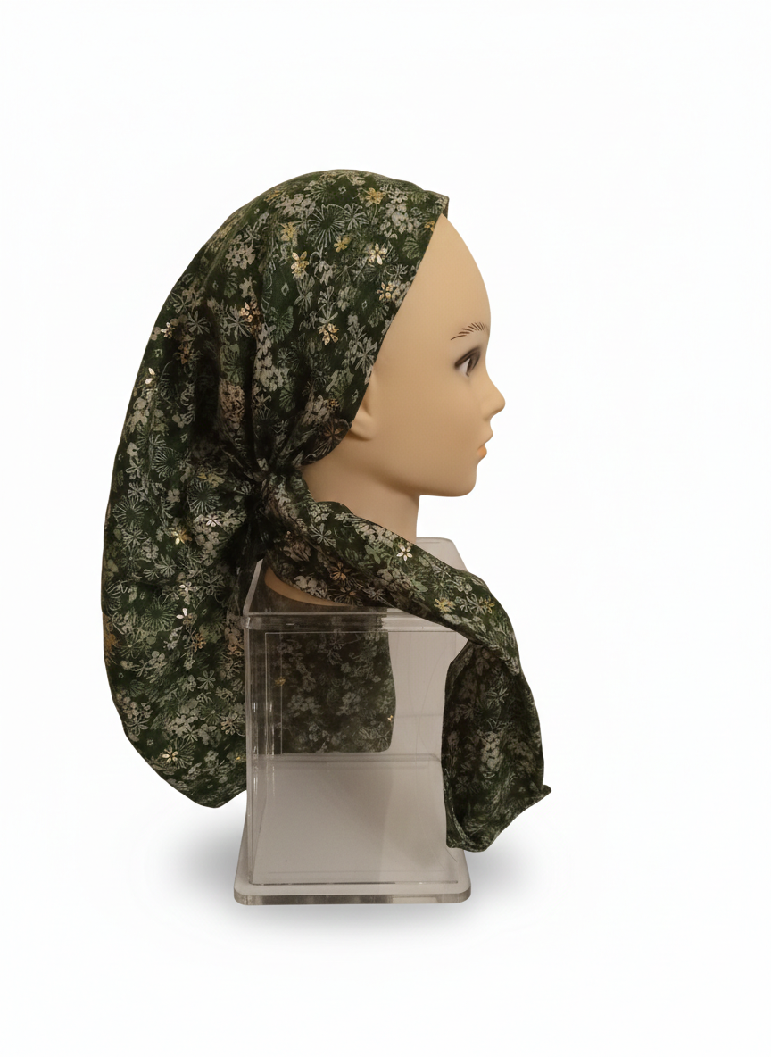 Mannequin head wearing a green camouflage-patterned headscarf on a white background