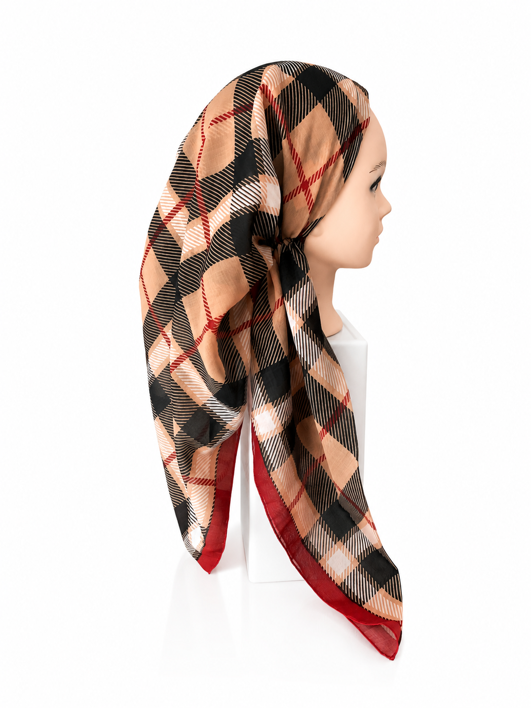 Plaid scarf on a mannequin head against a white background