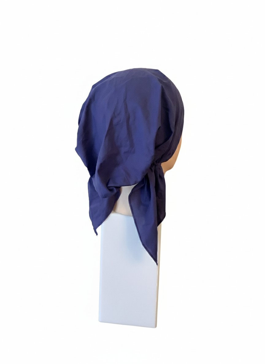 Navy blue tichel on a mannequin head against a white background