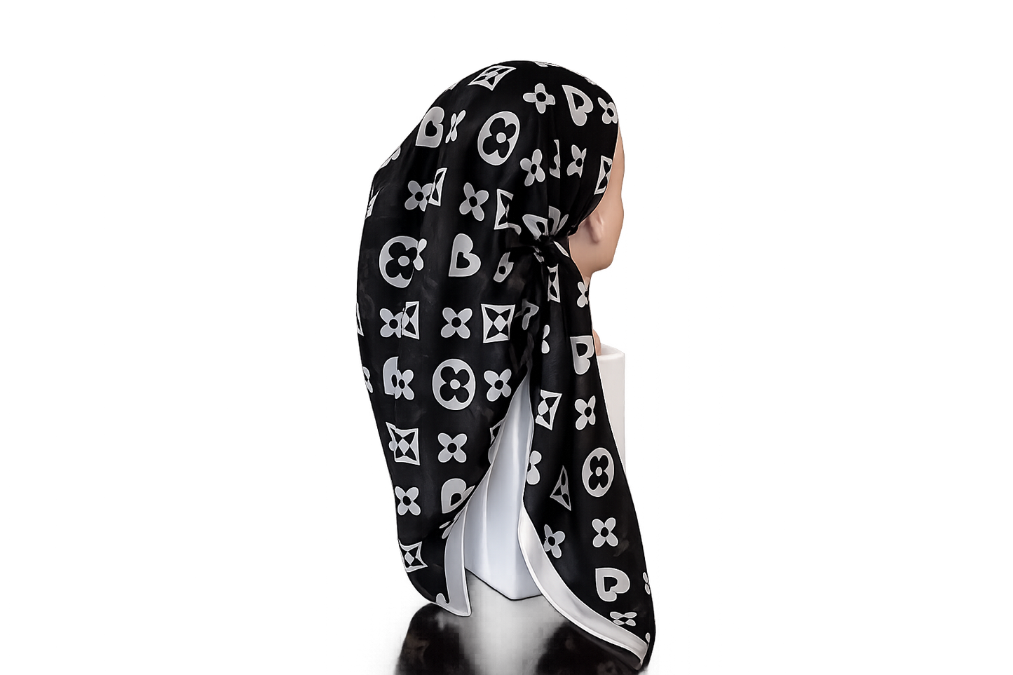 Black headscarf with white patterns on a white background