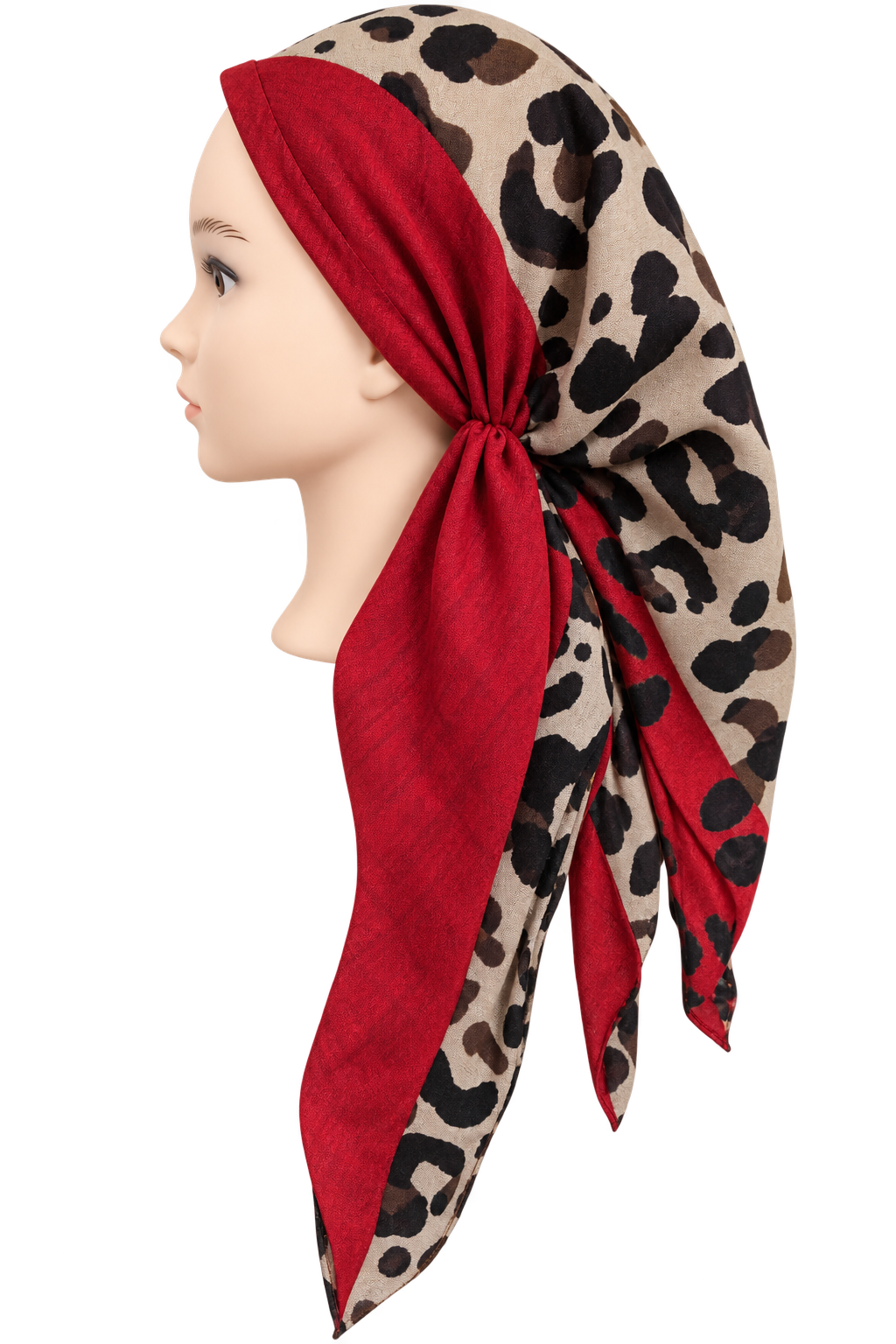 A beige scarf with a black leopard print pattern and solid red panels, styled on a mannequin head in profile against a white background.