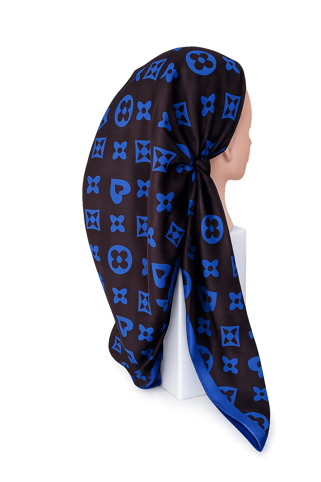 Black and blue patterned pretied tichel on a mannequin head against a white background