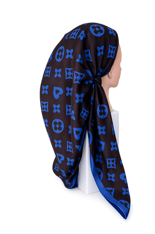 Black and blue patterned pretied tichel on a mannequin head against a white background