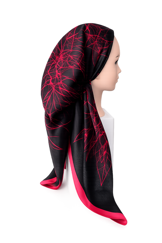 Black headscarf with red patterns worn by a mannequin on a white background
