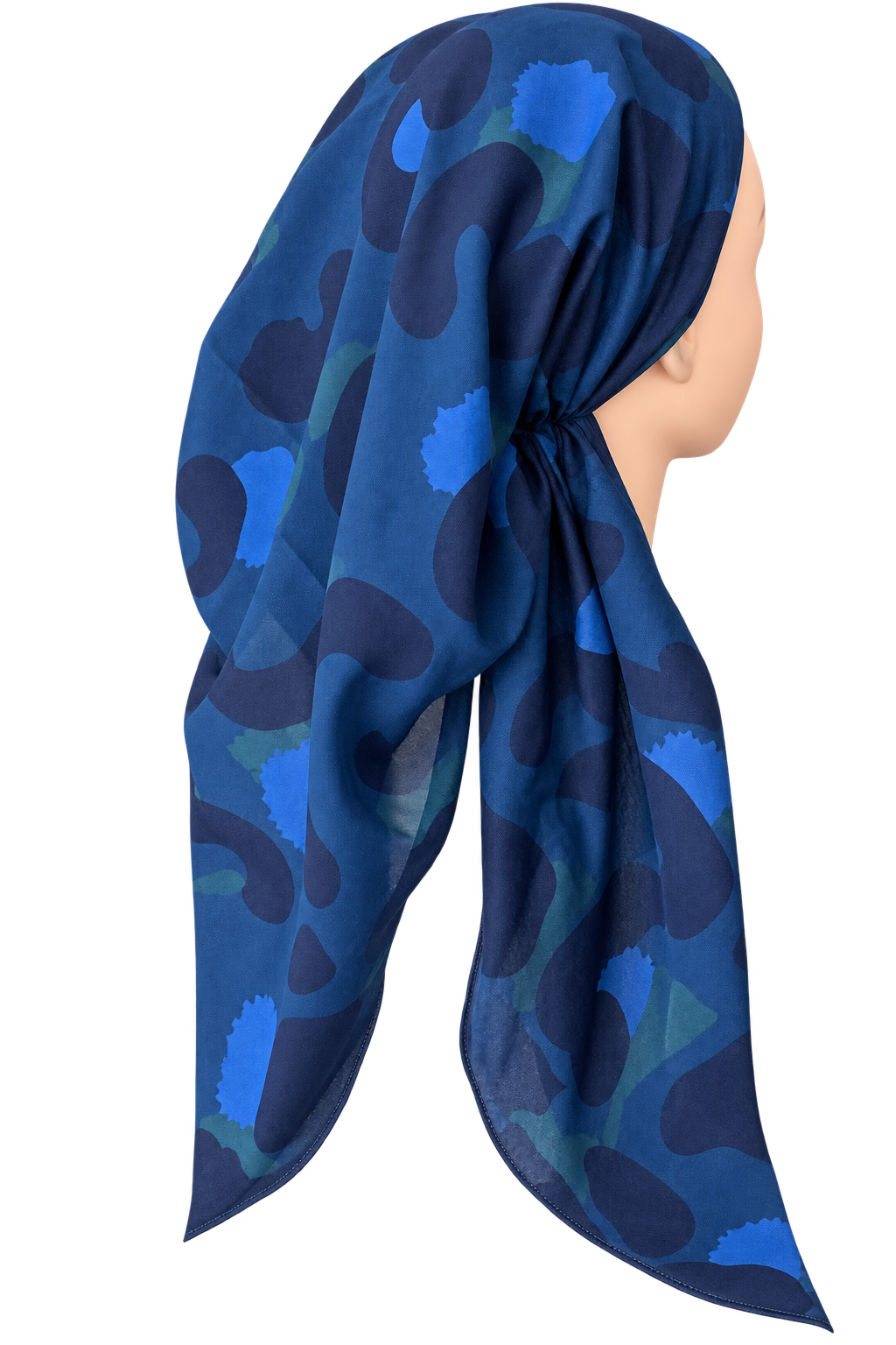 A blue patterned headscarf draped on a mannequin head, shown from the side against a plain white background.