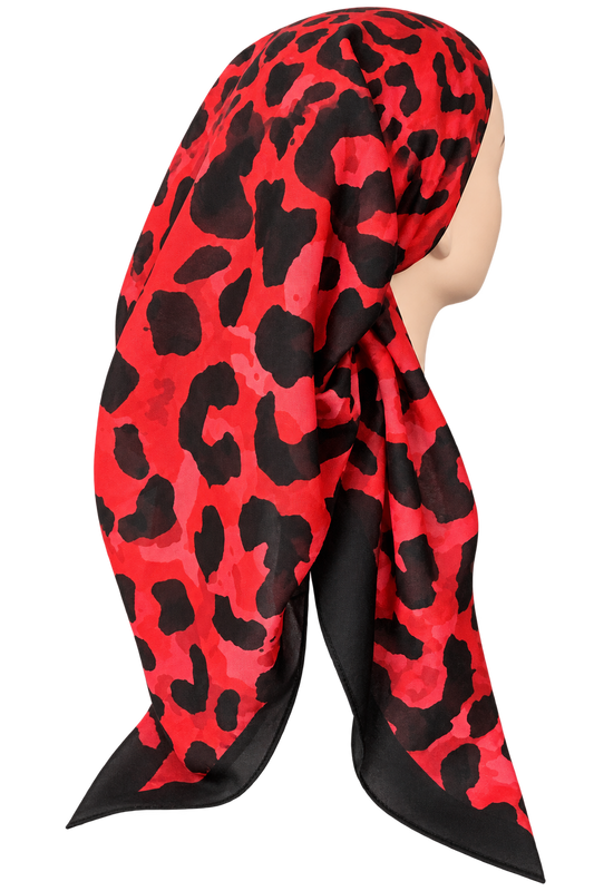 A red and black leopard print scarf styled on a mannequin head against a plain white background.
