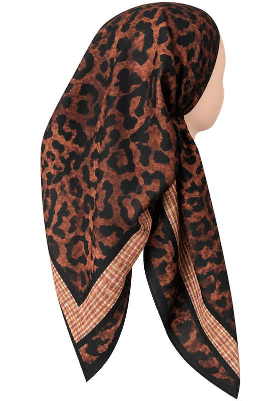 A leopard print hijab scarf with brown, black, and beige gingham checkered borders, displayed on a mannequin head against a white background.