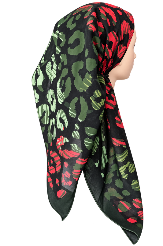 A black TICHEL scarf with a red and green leopard print pattern, styled on a mannequin head against a plain white background.