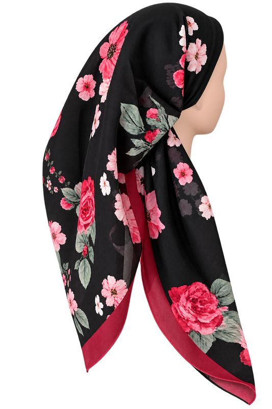 A black preteid tichel scarf with a vibrant pink and red floral print, styled on a mannequin head against a plain white background.