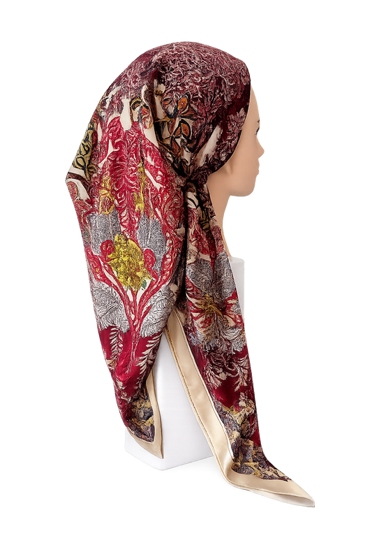 Woman wearing a patterned tichel on a white background