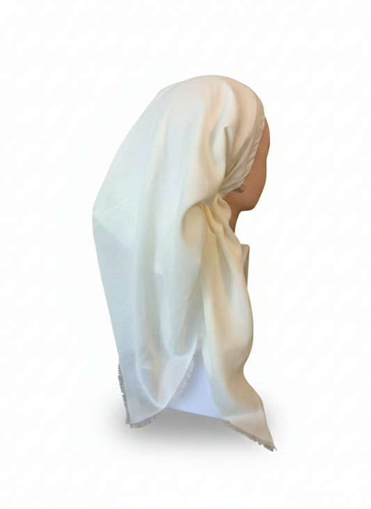 Mannequin head wearing a white tichel